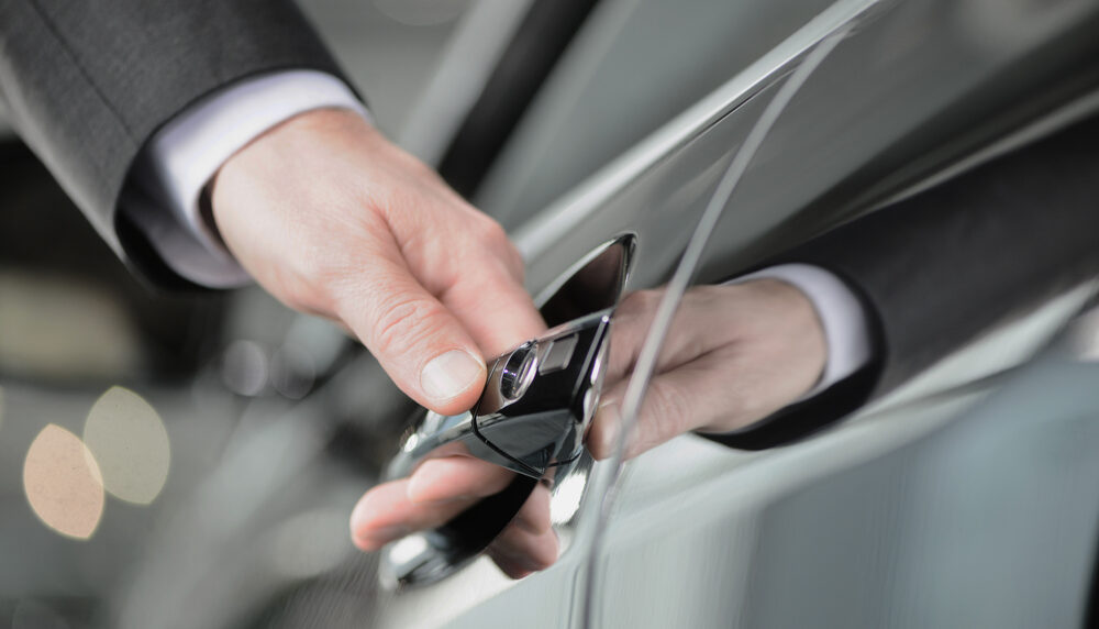 Hand,On,The,Car,Handle.,Businessman,Holding,His,Hand,On